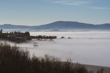 Mountains in succession that emerge from the fog seen from Monte delle Cesane in the province of Pesaro and Urbino in the Marche region