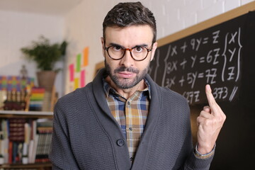Angry disrespectful teacher showing middle finger in class 