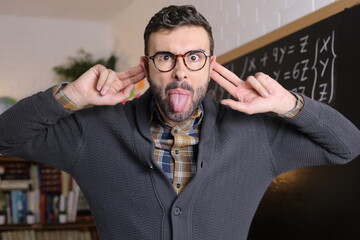 Angry teacher sticking tongue out