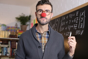 Humorous teacher wearing red clown nose 