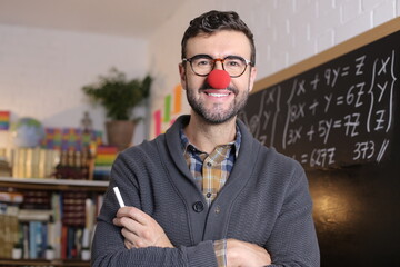 Humorous teacher wearing red clown nose