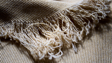 Vintage natural fabric. Natural fabric texture and background. Fringe.
