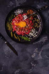 fresh beef tartar with tasty vegetables