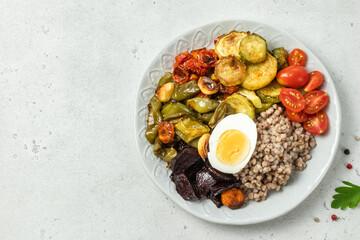 Egg buckwheat grilled vegetable bowl. Space for text.