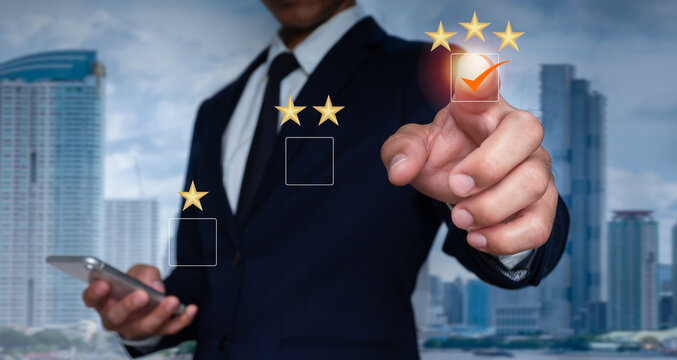 A guy points with finger and selects a three-star emoji to display on the virtual screen. A survey, poll,or questionnaire designed to gather information about user experience or customer satisfaction.