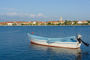 A boat and beautiful town of Nin in Croatia. Nin is a town of long tradition and a glorious past...