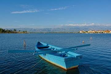 A wooden boat and beautiful town of Nin in Croatia. Nin is a town of long tradition and a glorious past and its natural beauties ensure it a special place in Croatian and European tourism.