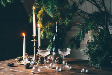 Decorative Christmas composition with candles, present and pine.