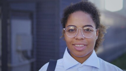Diligent serious african american student looking at camera, passing exams and entering prestigious university, receiving scholarship, keeping scientific experiments, progressiveness and success