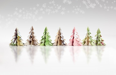Origami Christmas trees made of paper money. Miniature Xmas trees folded with fake Canadian...