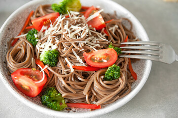 Noodles with dry soba on the side. Top view. Selective focus.
