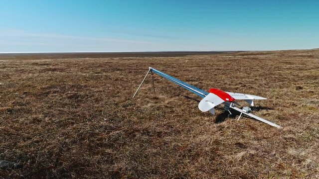 Side view of drone fixed on catapult and ready to be launched. Tundra researchings.