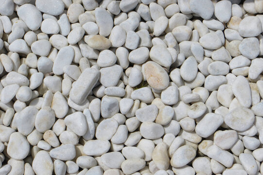 White oval pebbles background. Copyspace.
