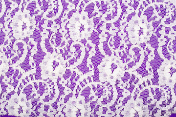 Background from white lace on a lilac background