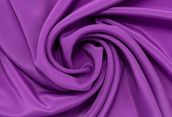 A piece of burgundy, violet, red cloth. Fabric texture for background and design works of art, beautiful wrinkled pattern of silk or linen. A crumpled piece of cloth