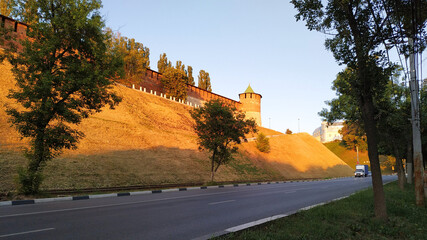 Nizhny Novgorod, the Kremlin. a sunny summer day with a blue sky. A long brick wall with a tower