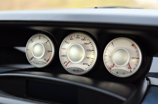 Close up image of a car speedometer. 