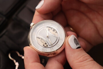 vintage mechanical pocket watch for a gentleman with a window through which you can see the working mechanism