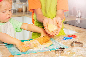 Obraz na płótnie Canvas Little toddler boy roll rolling-pin prepare dough