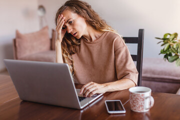 Frustrated upset woman freelancer has just got unpleasant bad news