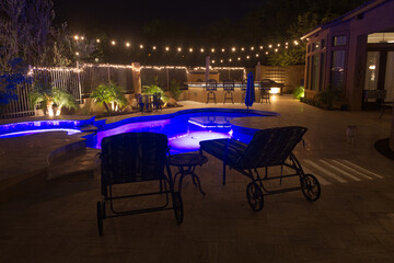 A high definition night time view of a desert landscaped backyard in Arizona.
