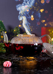 Christmas traditional spiced tea. Festive table setting with bokeh lights. Vertical orientation.