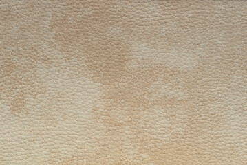 Abstract cream brown artificial leather texture, background.