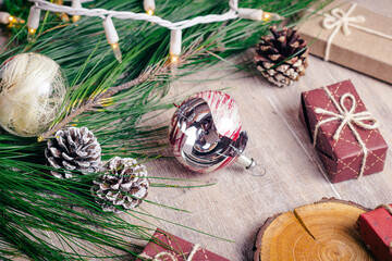 broken christmas sphere lying on the floor next to gifts