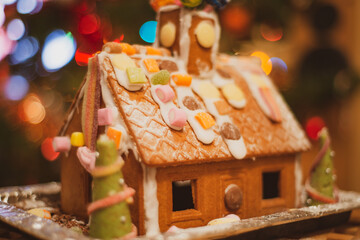 Christmas gingerbread house with sweets and confectionary decorations