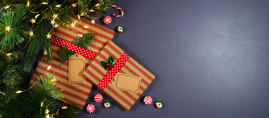 Christmas gift wrapping creative concept layout flatlay. Traditional kraft paper wrapped gifts with...