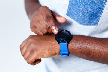 A person is pointing to his new blue clock.