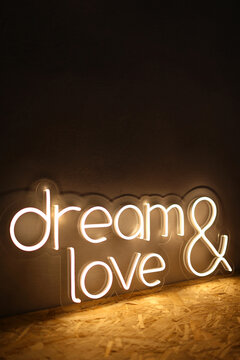 White neon sign with the inscription dream love. Trendy style. Wedding design. Neon sign. Custom neon. Home decor. 