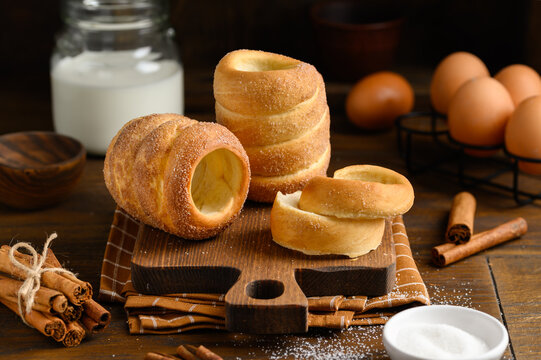 Traditional Czech homemade sweet bun trdelnik or trdlo. Dark background. Selective focus