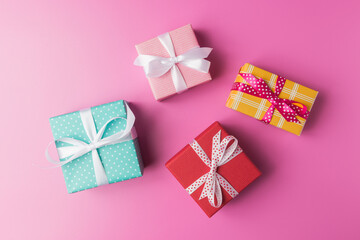 Various gift boxes on pink background.  Holiday concept