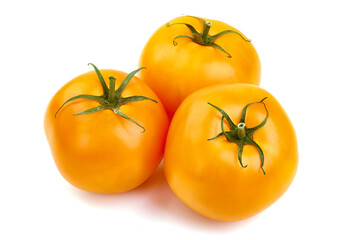 Fresh yellow tomatoes, isolated on white background.