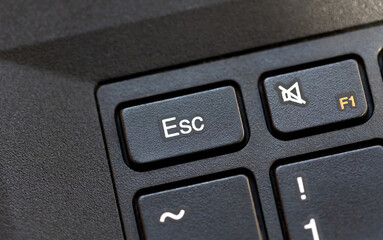 Laptop computer keyboard Esc, escape key macro detail, top view, object extreme closeup, from...