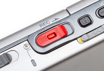 Simple red REC audio recording button, recorder device switch on a portable sound recorder, detail,...