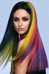 Beautiful woman with multi-colored hair and creative make up and hairstyle. Beauty face.