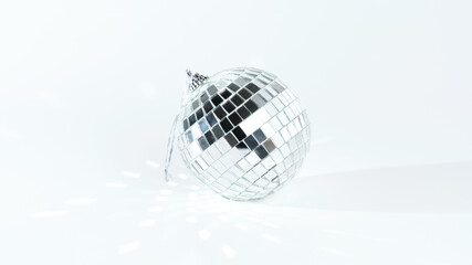 Christmas decoration in the form of a disco ball on a white background discards reflexes