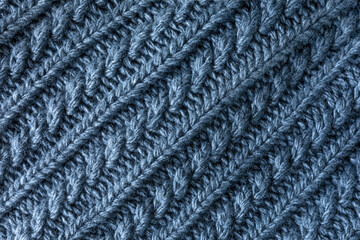 sample of grey wool knitting. background of gray wool fabric. diagonal arrangement