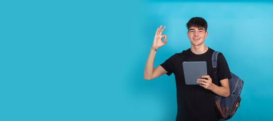 teenage student with tablet isolated on background