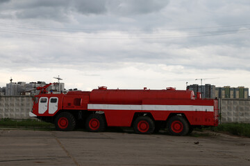 old red fire truck at the airfield