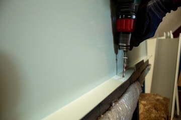 Close-up Of Drill Bit Making Hole In Metal