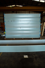 lots of skylights under construction. parts and work of a metallurgical and construction industry