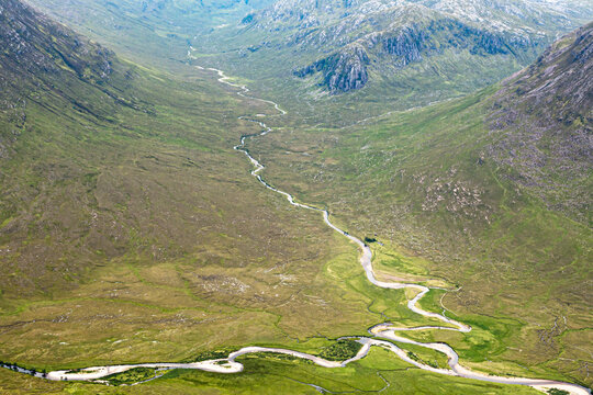 Two Rivers Meeting At Bottom Mountain Valley In Scottish Highlands