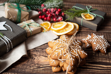 christmas composition presents, gingerbread cookies, oranges on the table