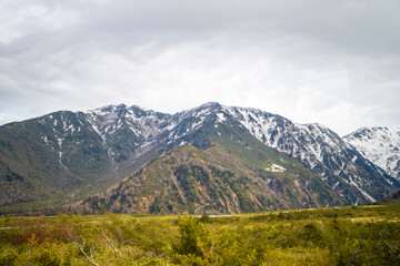 富山県立山町にある立山の冬の雪景色のある風景 Landscape with snowy winter scenery of Tateyama in Tateyama Town, Toyama Prefecture, Japan.