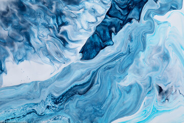 Abstract acrylic pouring art in colors of ocean. Waves and swirls. Texture with marble effect