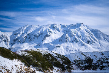 富山県立山町にある立山の冬の雪景色のある風景 Landscape with snowy winter scenery of Tateyama in Tateyama Town, Toyama Prefecture, Japan.