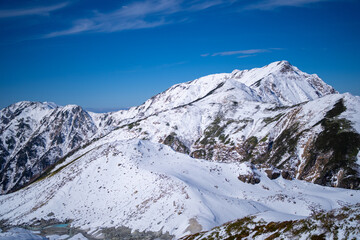 富山県立山町にある立山の冬の雪景色のある風景 Landscape with snowy winter scenery of Tateyama in Tateyama Town, Toyama Prefecture, Japan.